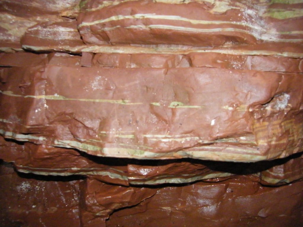 The Red Chamber showing the smooth red rock of the cave.