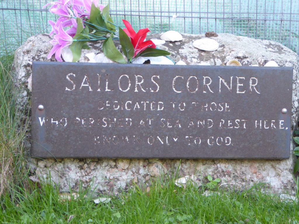 Sailors Corner with slate memorial stone: Dedicated to those who perished at sea and rest here, known only to God.