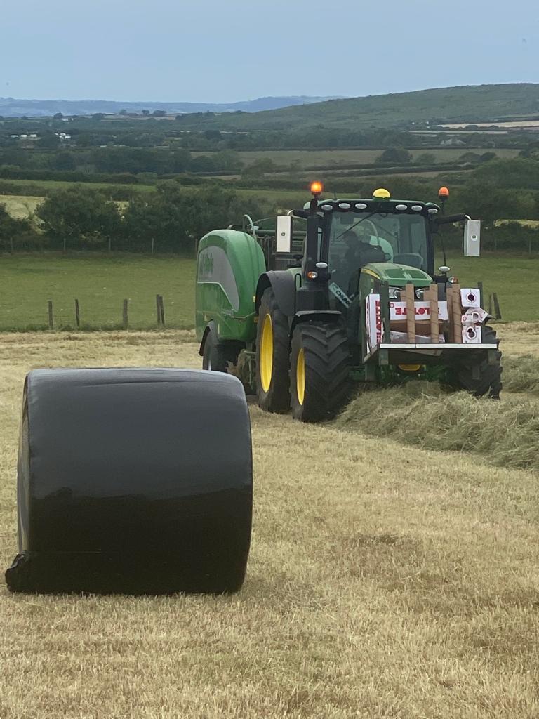 Tractor making hay.
